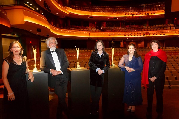From left to right, the 2014 Dayton Literary Peace Prize winners: Margaret Wrinkle,  Bob Shacochis, Louise Erdrich, Karima Bennoune, and Jo Roberts pose with their prizes before the awards ceremony.
