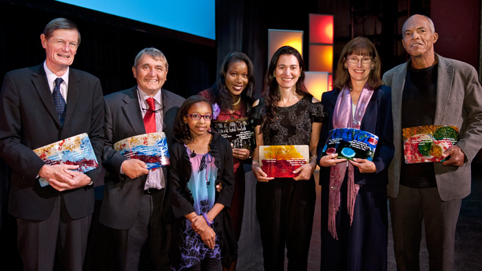 (Left to Right) David Eltis and David Richardson, authors of “Atlas of the Transatlantic Slave Trade” Isabel Wilkerson, author of “The Warmth of Other Suns” Nicole Krauss, author of “Great House” Mary Helen Stefaniak, author of “The Cailiffs of Baghdad, Georgia” John Edgar Wideman, winner of Lifetime Achievement Award Essence Cain, poet “In the Flower Market” (front)
